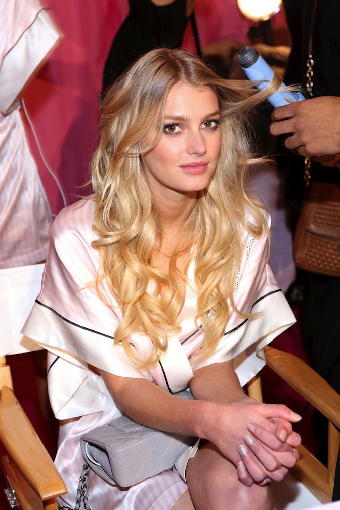 Model Sigrid Agren poses at the 2013 Victoria's Secret Fashion Show hair and make-up room at Lexington Avenue Armory in New York City