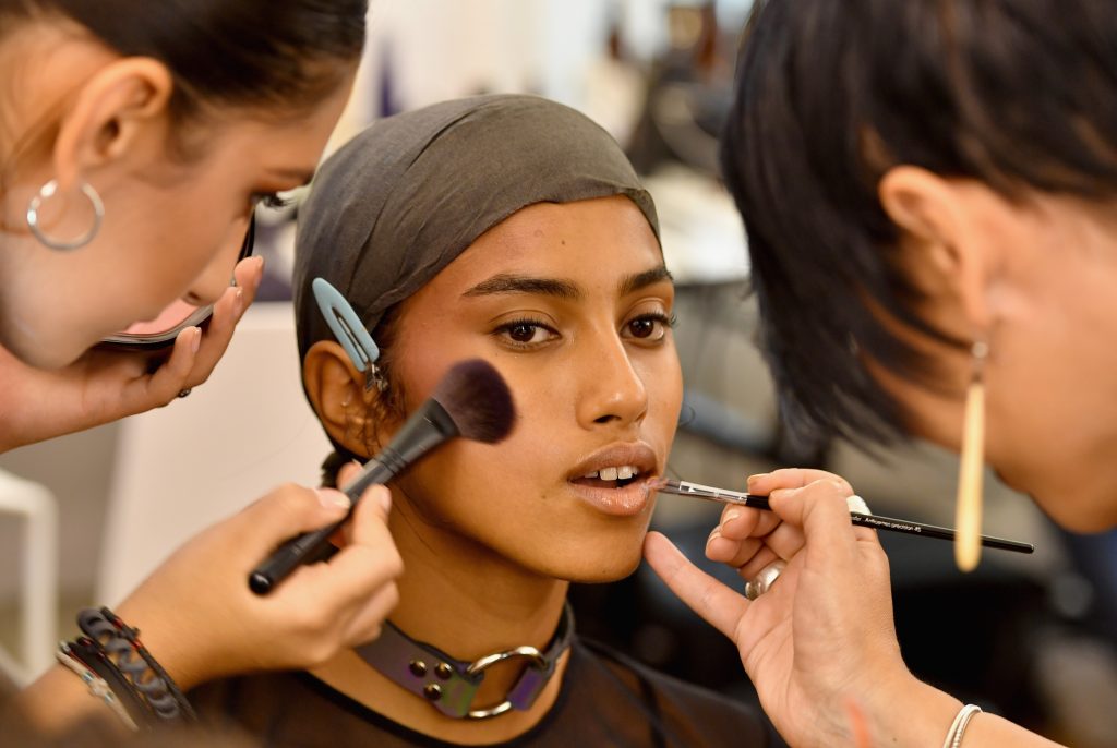 A model prepares backstage during FENTY x PUMA by Rihanna at Hotel Salomon de Rothschild on September 28, 2016 in Paris, France.