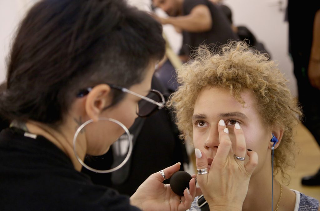 A model prepares backstage during FENTY x PUMA by Rihanna at Hotel Salomon de Rothschild on September 28, 2016 in Paris, France.