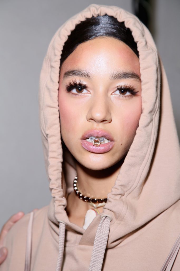 A model prepares backstage during FENTY x PUMA by Rihanna at Hotel Salomon de Rothschild on September 28, 2016 in Paris, France.